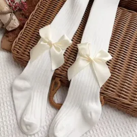 Плътен бебешки чорапогашник с панделка